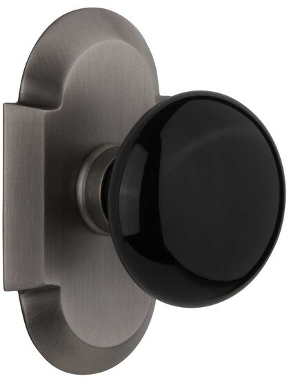 Arched Rosette Door Set with Black Porcelain Knobs in Antique Pewter.